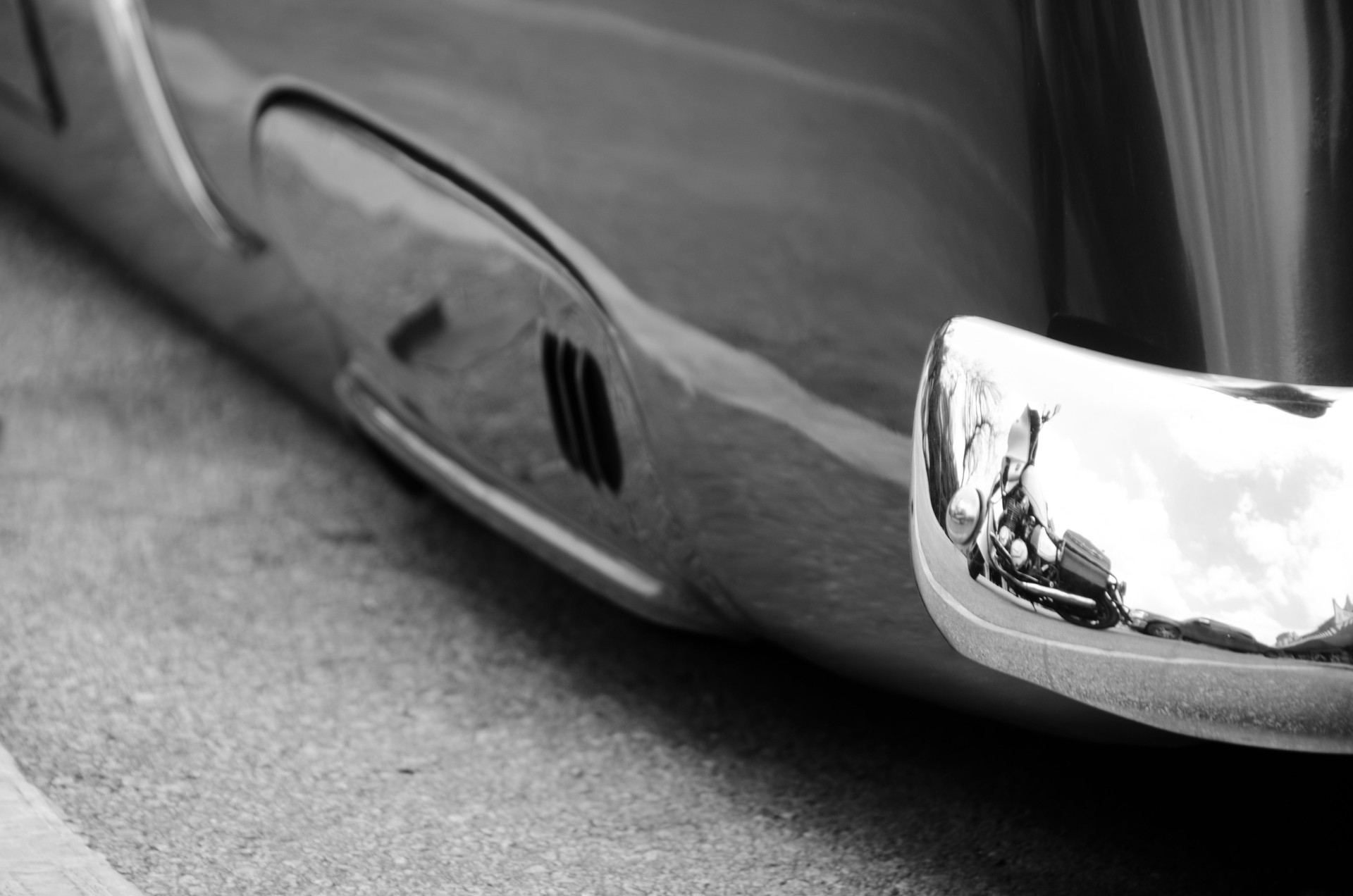 Reflections in chrome details of of exterior of a classic car in SoCo, Austin